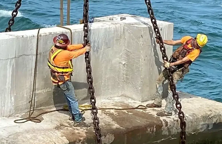 Rigging a large piece of concrete for removal from the ocean